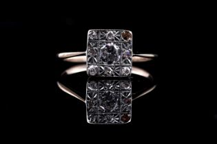 An Edwardian diamond plaque ring