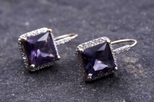 A pair of contemporary amethyst and diamond pendant earrings