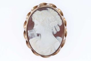 A modern carved cameo brooch depicting the Greek mythological muse Erato