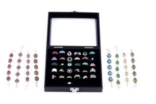 A collection of contemporary gem-set rings and bracelets