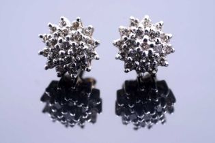 A pair of diamond flowerhead cluster earrings