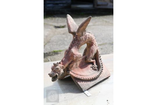 A cast terracotta dragon ridge tile, 47 cm x 43 cm high