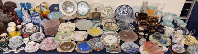An extensive lot including cake stands, copper lustre jugs, Poole pottery tea set, pottery jugs,