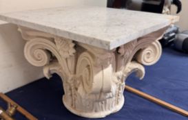 An occasional table with a marble top,