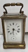 A French brass carriage clock, with a platform escapement,