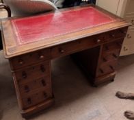 A Victorian mahogany pedestal desk with a rectangular leather inset top,
