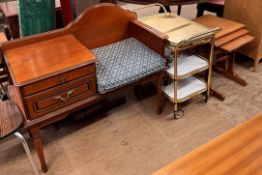 A teak nest of three tables together with a tea trolley and a telephone table
