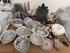 A pair of natural grey agate bookends together with a collection of shells, hardstone eggs,