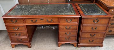 A reproduction yew pedestal desk together with a matching filling cabinet