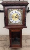 A 20th century drop dial wall clock with a silvered dial and Roman numerals the base with a glass