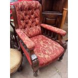 A Victorian mahogany framed library chair with deep buttoned upholstery,