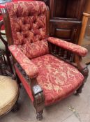 A Victorian mahogany framed library chair with deep buttoned upholstery,