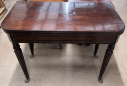 A 19th century mahogany card table with a rectangular top with rounded corners and a baize interior