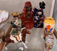 A Beswick figure of a child on a pony, Clarice Cliff crocus pattern vase,