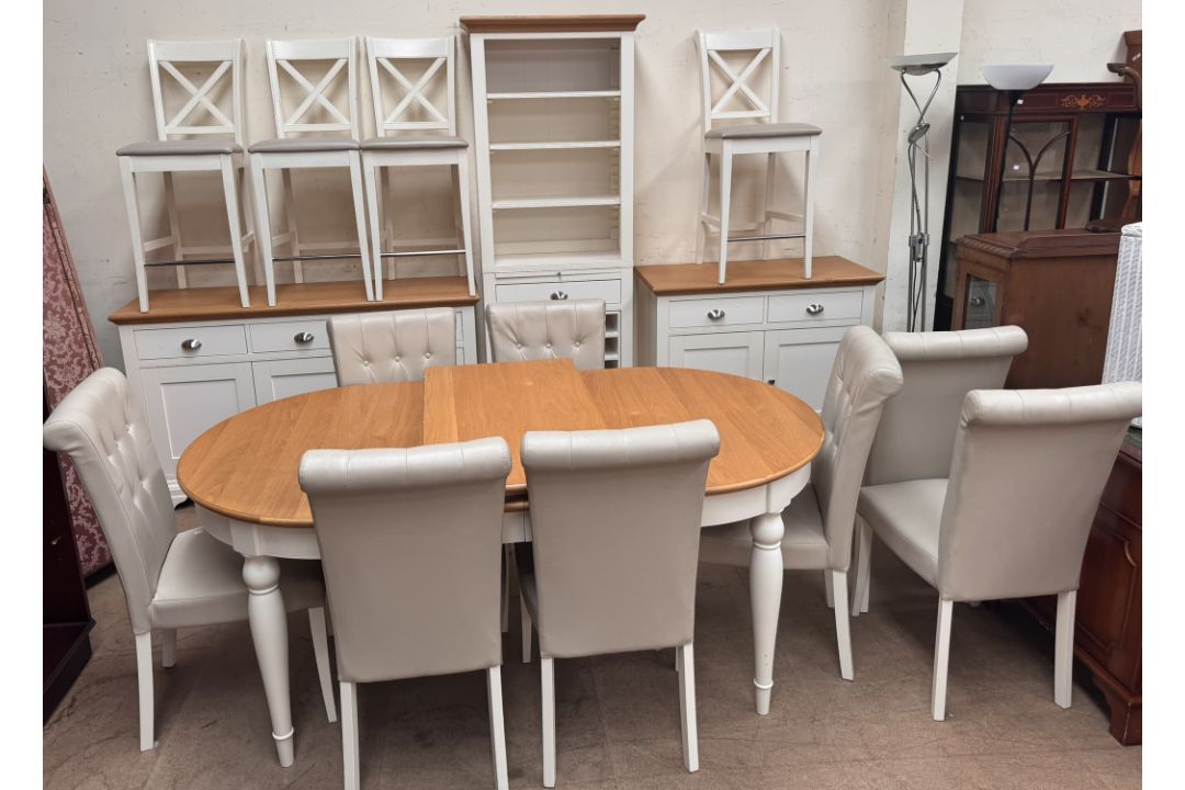 A modern oak and cream painted kitchen table and eight chairs together with a matching sideboard, - Image 1 of 6