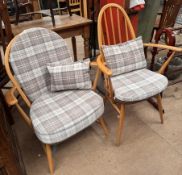 An Ercol Windsor model 203 armchair with a spindle back,