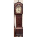 A 19th century mahogany longcase clock with an arched hood, short trunk door,