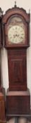 A 19th century mahogany longcase clock with an arched hood, short trunk door,