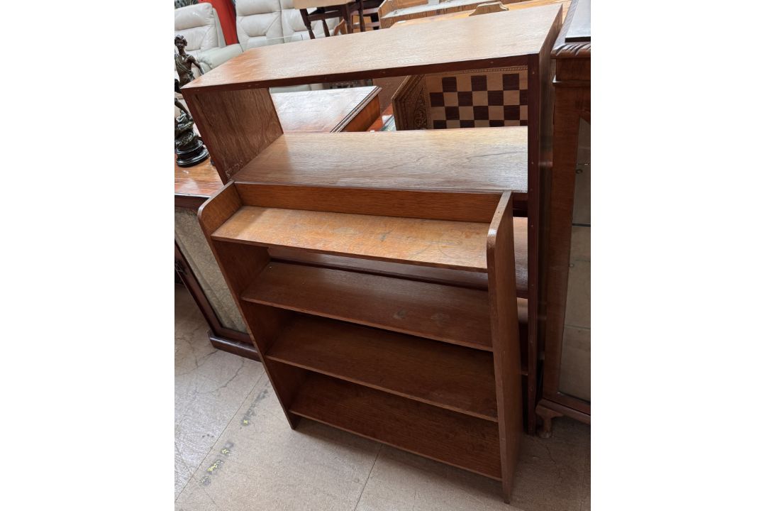 A 20th century oak bookcase together with a teak example