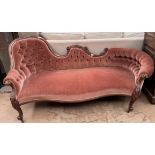 A Victorian walnut framed double chair back settee,
