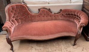 A Victorian walnut framed double chair back settee,