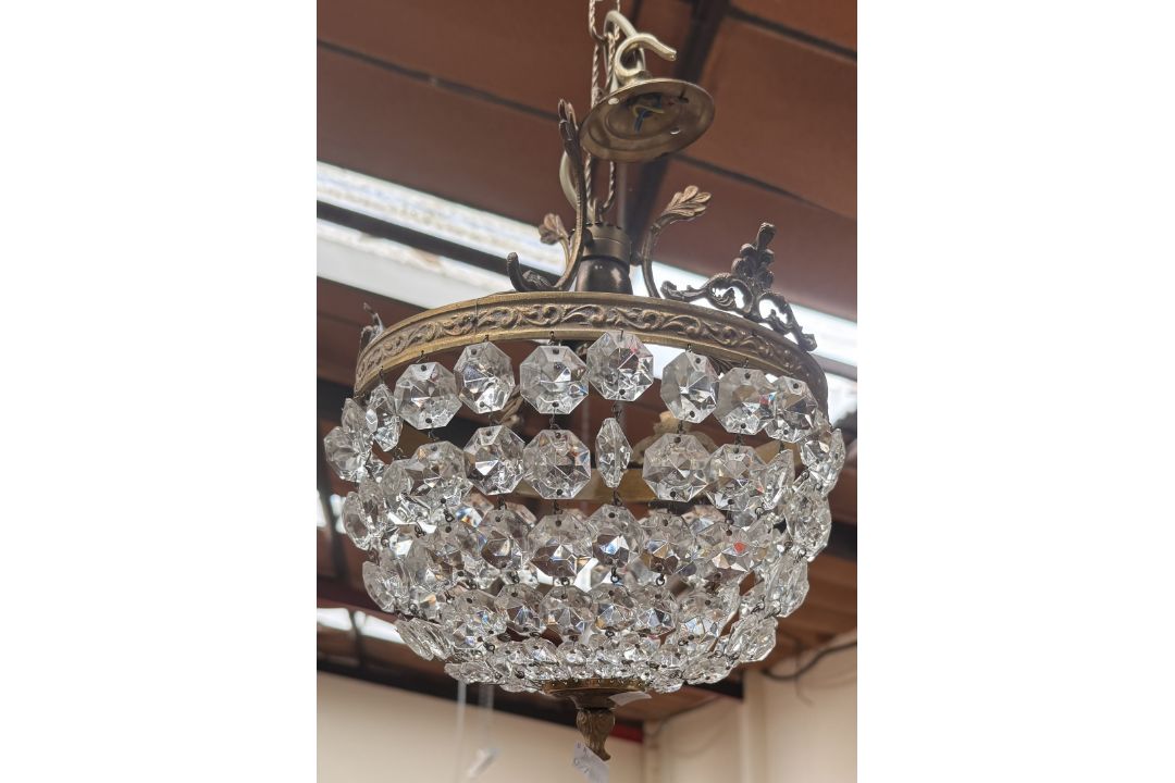 A brass and cut glass basket chandelier