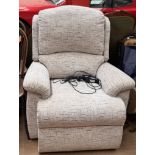 A cream upholstered electric recliner chair
