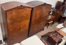 A 20th century burr walnut bedroom suite comprising two wardrobes, dressing table, stool,