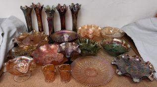 A collection of carnival glass including vases,