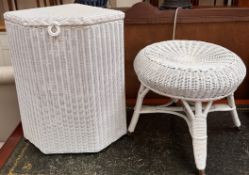 A white painted loom corner laundry basket together with a white painted stool of similar design