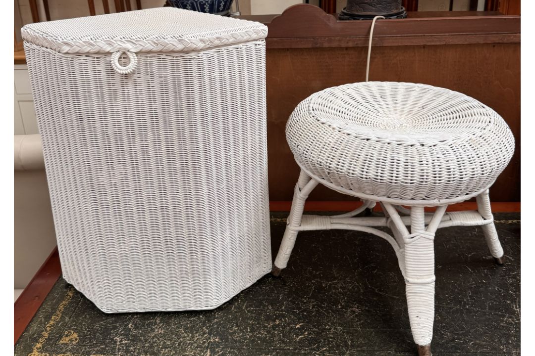 A white painted loom corner laundry basket together with a white painted stool of similar design