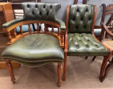 A green leather horseshoe shaped elbow chair together with a single chair