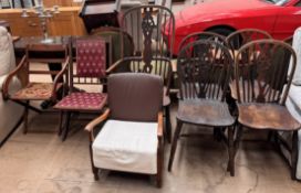 A set of four wheelback kitchen chairs together with a Wheel back Windsor chair and three other