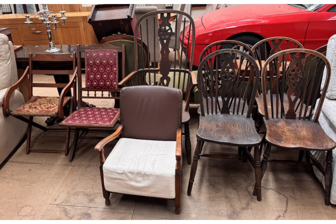 A set of four wheelback kitchen chairs together with a Wheel back Windsor chair and three other