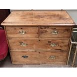 A Victorian pine chest with a rectangular top above two short and two long drawers