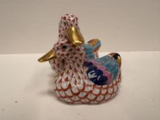 An Herend hand painted model of two ducks in pinks and blues