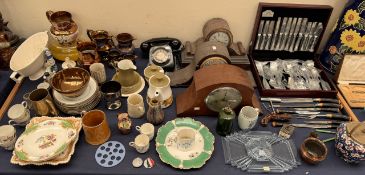 A Butler stainless steel cased part flatware service together with a carving set, mantle clocks,