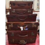 Six assorted graduated suitcases,