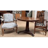 A Victorian mahogany supper table together with an Arts and Crafts style oak elbow chair and an