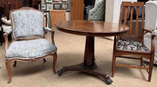 A Victorian mahogany supper table together with an Arts and Crafts style oak elbow chair and an