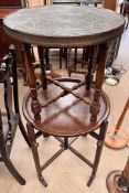 An oak folding occasional table with a circular dished top on a folding base together with a brass