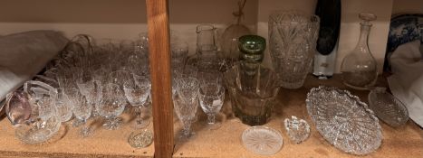 A collection of glass bird paperweights together with crystal drinking glasses, decanters,