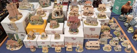 A collection of Lilliput Lane cottages including Eilean Donan Castle, Craigievar castle,