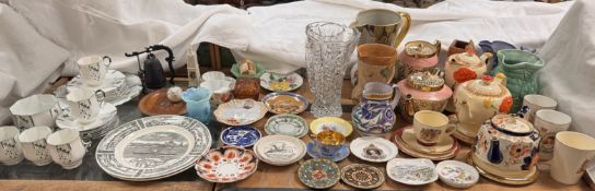 A Poole pottery jug together with an Arthur Wood part tea service, pottery jugs, plates,