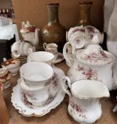 A pair of Royal Doulton leaf pattern vases together with a Paragon part tea set and a Royal Albert