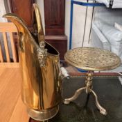 A brass coal scuttle together with a brass trivet