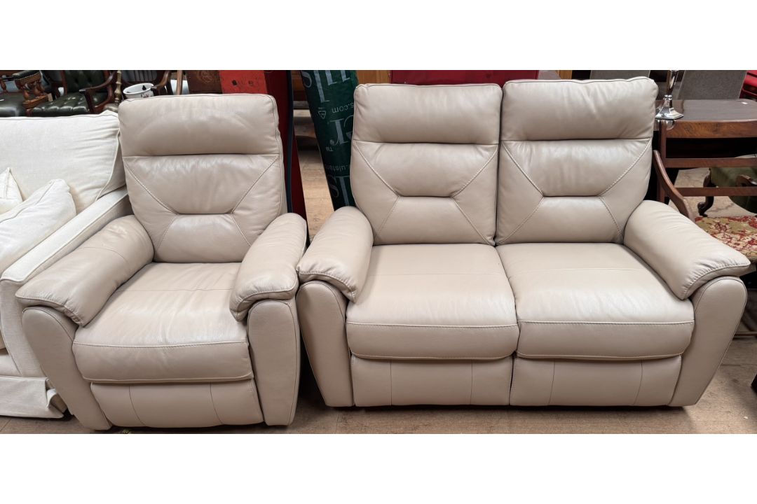 A leather two seater recliner settee together with a matching reclining armchair