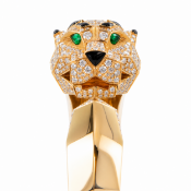 VERY FINE ONYX AND DIAMOND PANTHER BANGLE, IN THE STYLE OF CARTIER