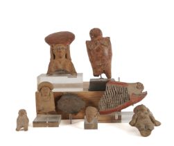 A GROUP OF SEVEN EARTHENWARE FIGURE FRAGMENTS AND A WHISTLE (8)