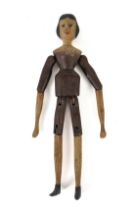 OF FOLK ART INTEREST: A PAINTED ARTICULATED DOLL